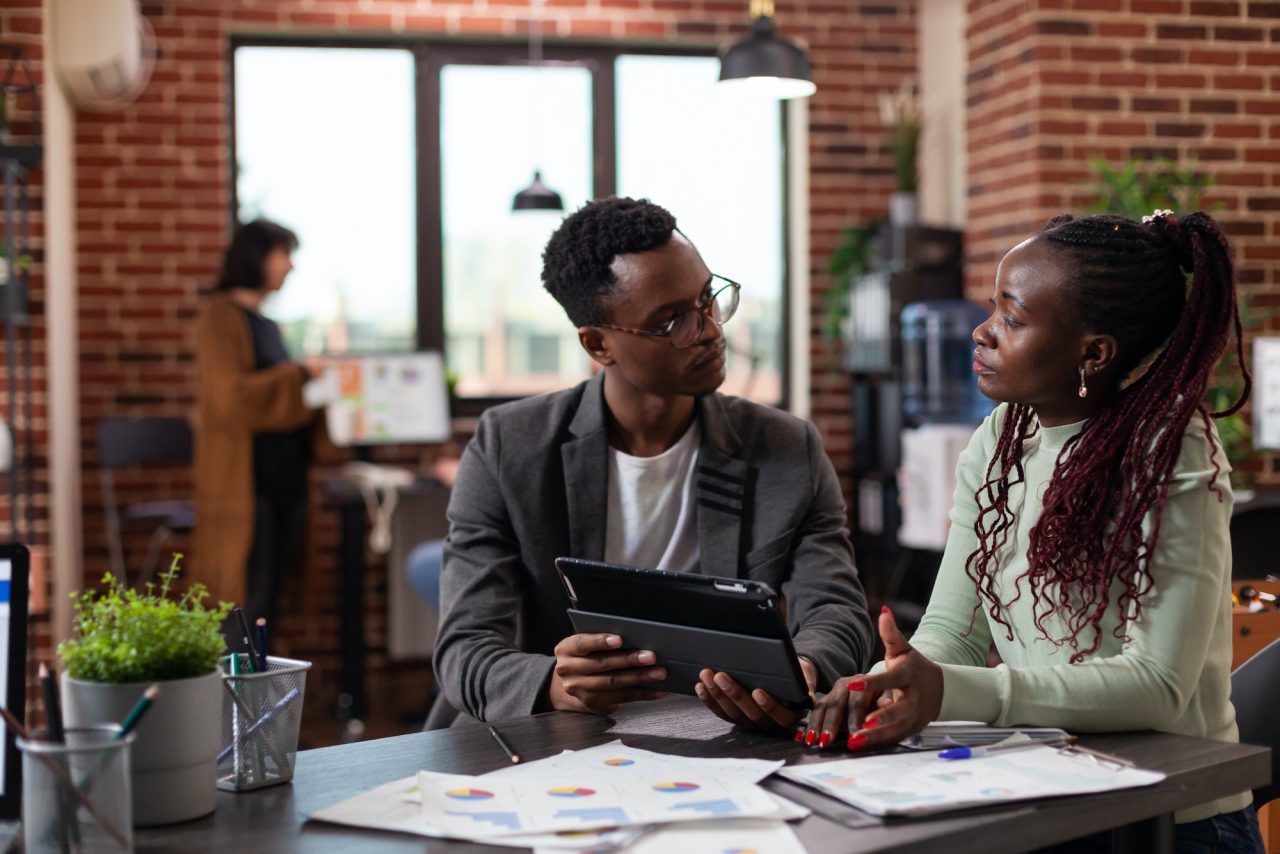 executive managers analyzing marketing statistics.jpg